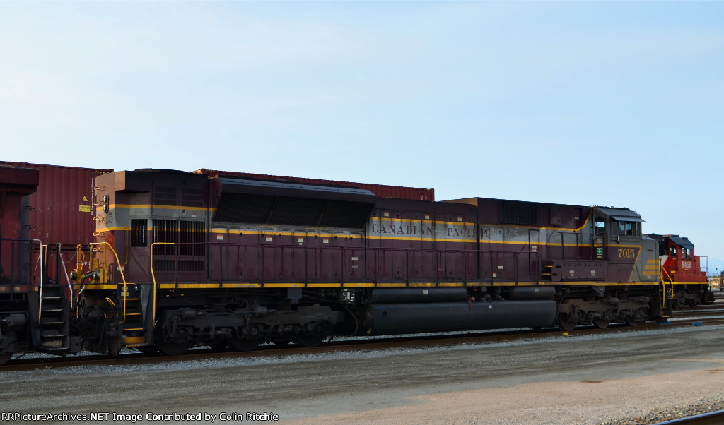 CP Heritage SD70 ACU, #7015waiting to head E/B departing Roberts' Bank Yard with a unit stack train.